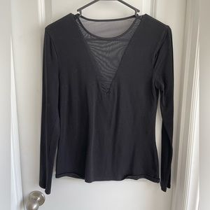 Fitted black Express top with v-neck cutouts on front and back